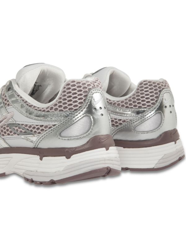 Nike P-6000 sneakers in a silver and purple colorway, featuring a breathable mesh upper with contrasting paneling.