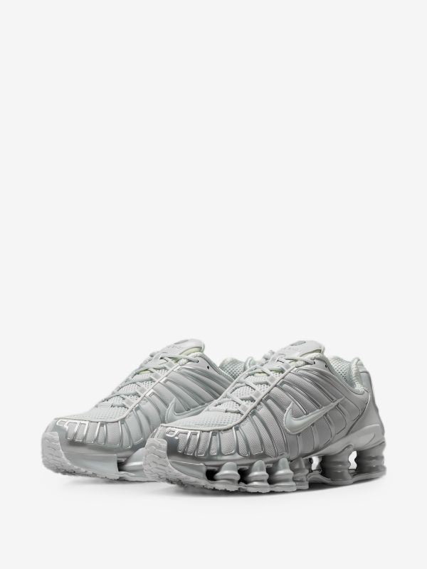 Nike Shox TL sneakers in a Wolf Grey or Pure Platinum/Chrome colorway.