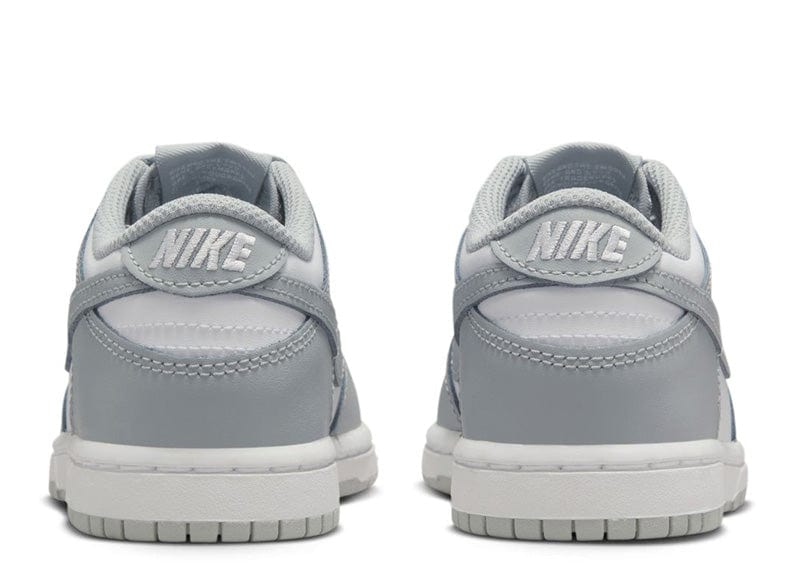 Nike Dunk Low sneakers in a white and light smoke grey colorway.