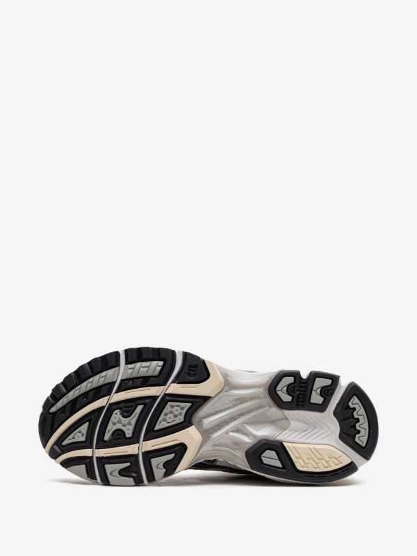ASICS GEL-KAYANO 14 sneakers in the "White/Midnight" colorway, featuring a late 2000s running aesthetic.