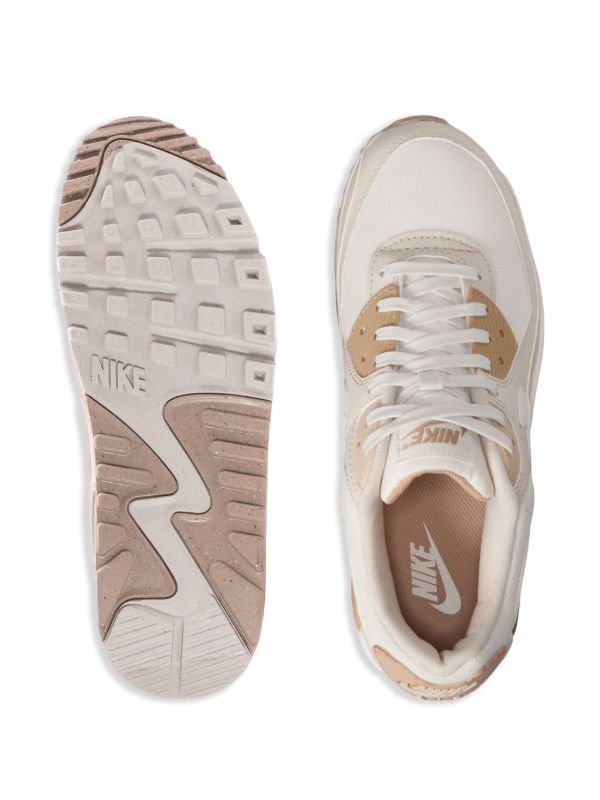 Nike Air Max 90 sneakers in a neutral beige and "Coconut Milk" colorway.