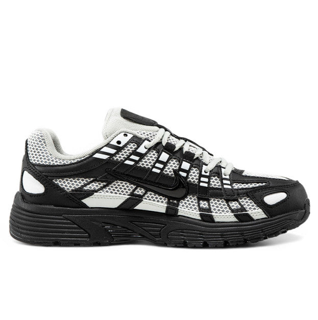 Nike P-6000 sneaker in a black and white colorway, inspired by early 2000s running style.