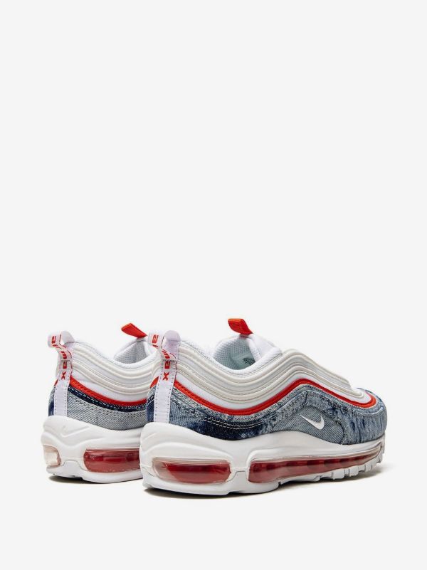 Nike Air Max 97 "Washed Denim Pack" sneakers, recognizable by their unique blue denim texture paired with bright red accents and a white sole.