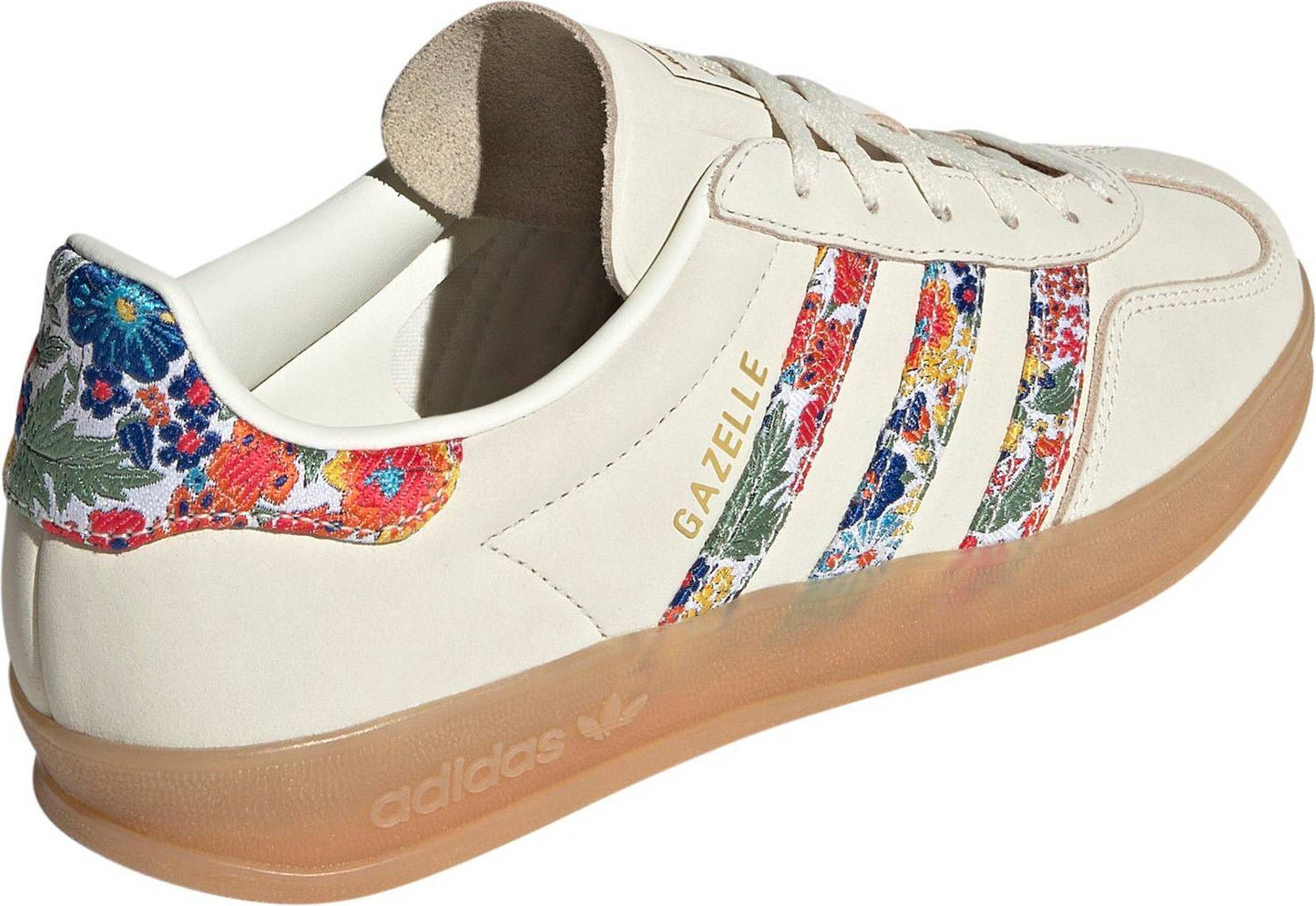 Adidas Women's Gazelle Indoor x Liberty London sneakers, featuring a cream nubuck upper with a vibrant floral embroidery pattern on the three stripes.