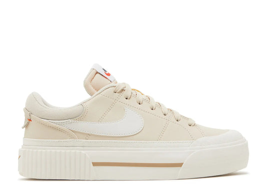 Nike Women's Court Legacy Lift platform sneakers in a Pearl White/Phantom colorway, featuring a chunky sole and stitched leather design.