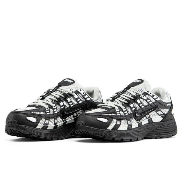 Nike P-6000 sneaker in a black and white colorway, inspired by early 2000s running style.