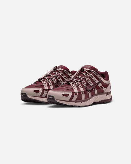 Nike Women's P-6000 sneakers in a Burgundy Crush and Taupe Grey colorway, featuring a retro-inspired design with a quick lacing system.