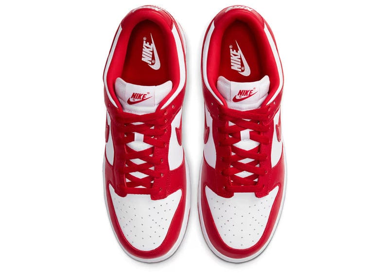 Nike Dunk Low SP "St. John's" sneakers featuring a bold white and university red leather upper.