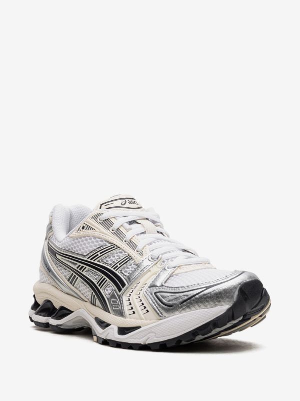 ASICS GEL-KAYANO 14 sneakers in the "White/Midnight" colorway, featuring a late 2000s running aesthetic.