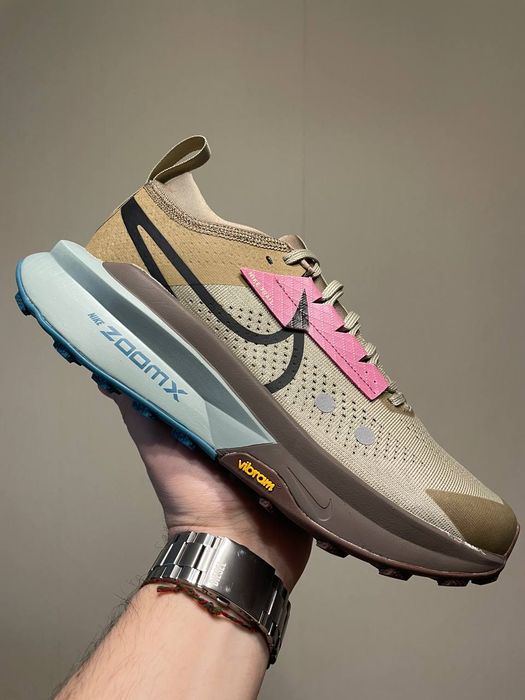 Nike Zegama 2 trail-running shoes in a Malt, Ghost, and Alabaster colorway.