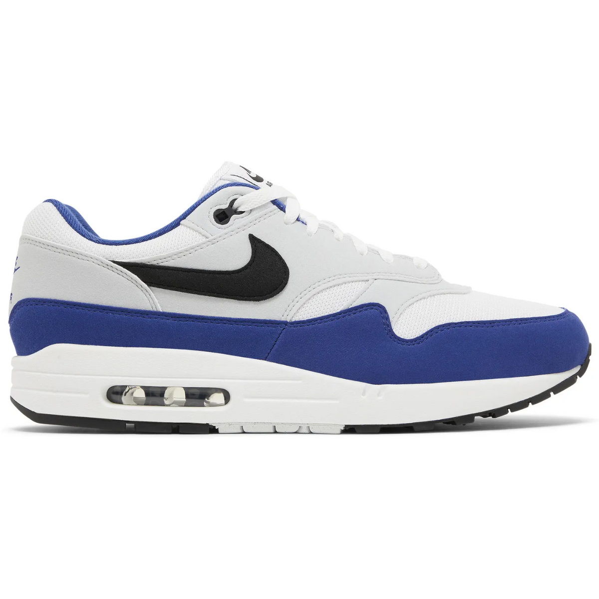 Nike Air Max 1 sneakers in the Deep Royal Blue colorway, featuring a white mesh upper with blue suede overlays and a black