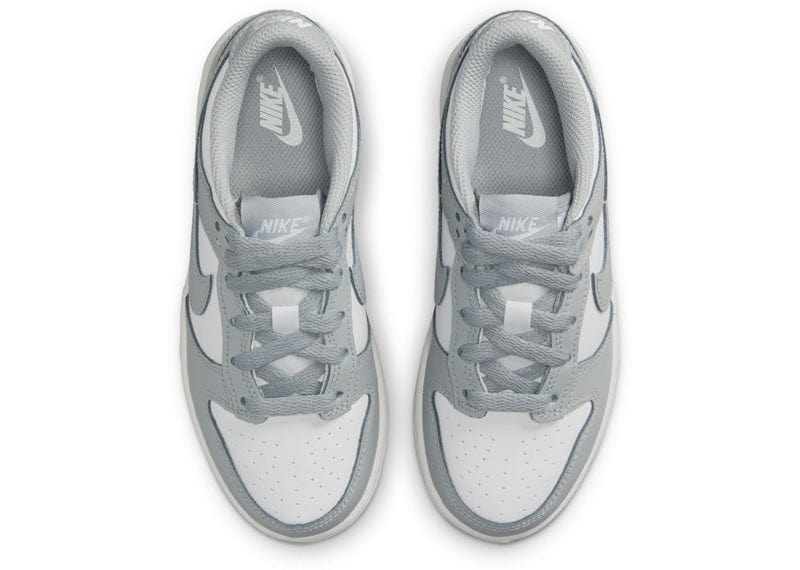 Nike Dunk Low sneakers in a white and light smoke grey colorway.