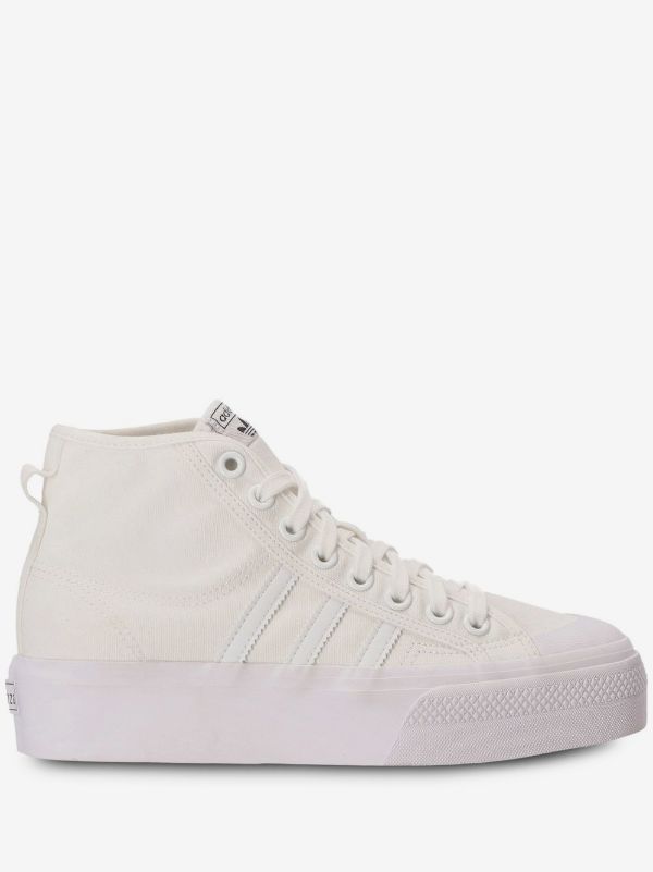 Adidas Nizza Platform Mid sneakers in "Triple White," featuring a thick flatform rubber sole.