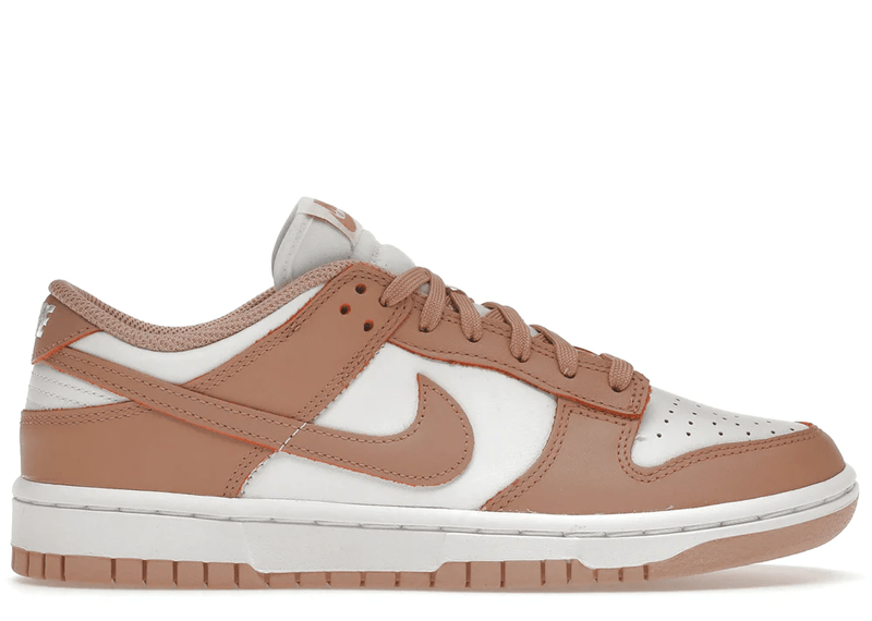 Nike Dunk Low "Rose Whisper" sneakers, featuring a two-tone white and pastel pink leather construction.