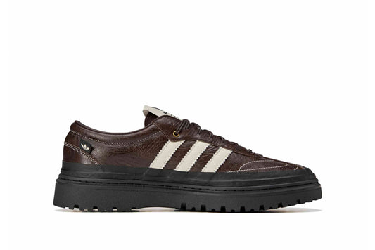 Adidas Samba LX Freizeit sneaker features a dark brown tumbled leather upper and a prominent SFTM-009 tag on the side.