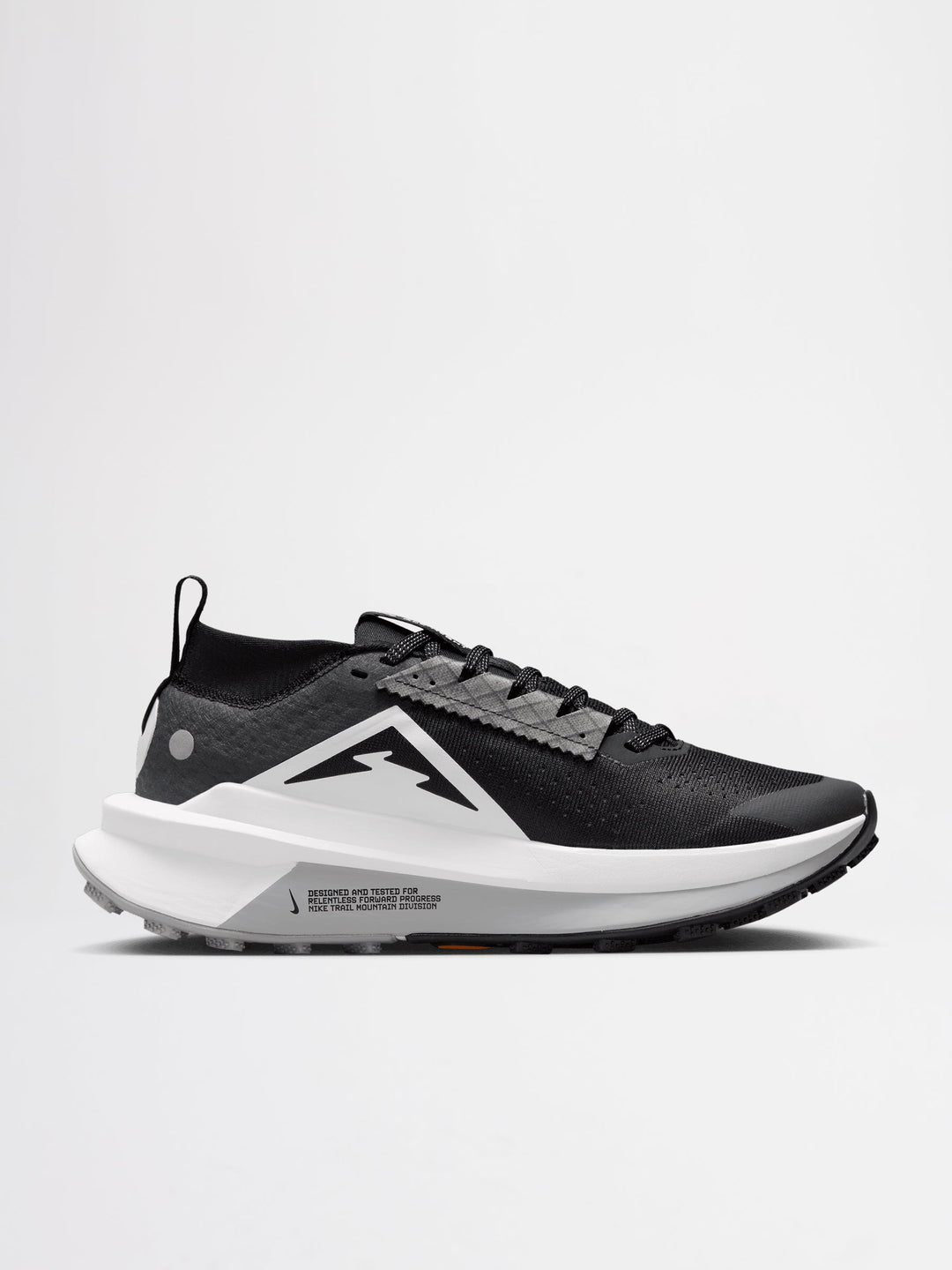 Nike Zegama Trail 2 running shoes in a black, white, and wolf grey colorway, featuring a durable Vibram outsole for traction.