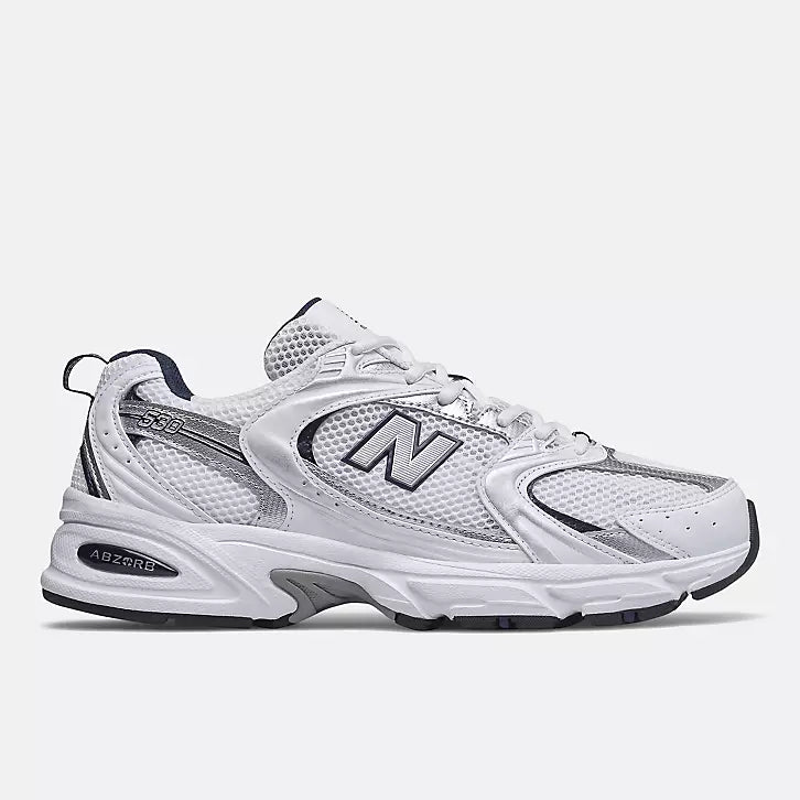New Balance 530 sneakers in a white and navy blue colorway.