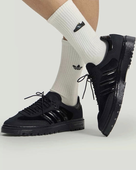 Adidas Samba WTR sneakers in black, featuring a textured lug sole and premium paneled design.