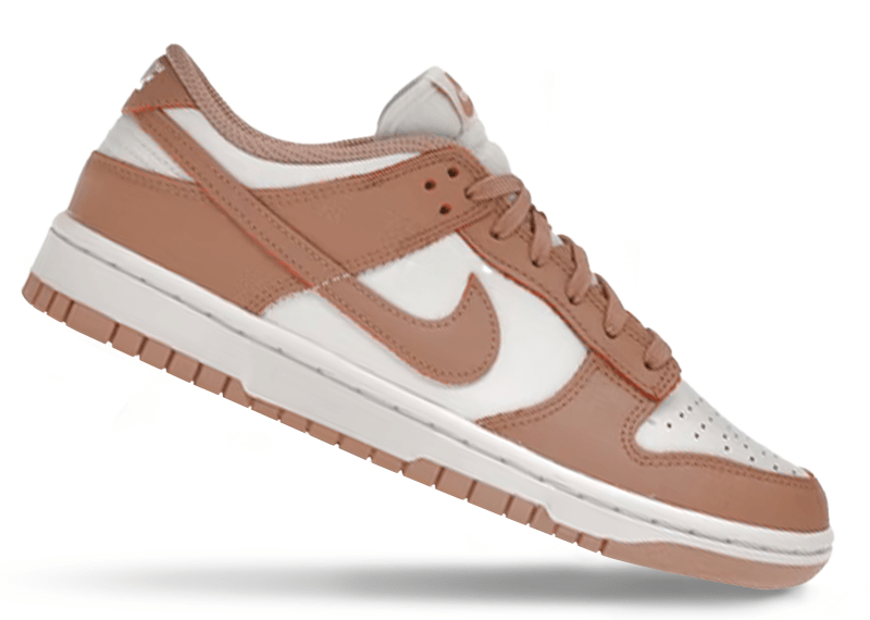 Nike Dunk Low "Rose Whisper" sneakers, featuring a two-tone white and pastel pink leather construction.
