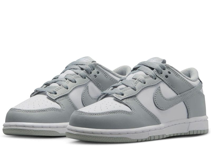 Nike Dunk Low sneakers in a white and light smoke grey colorway.