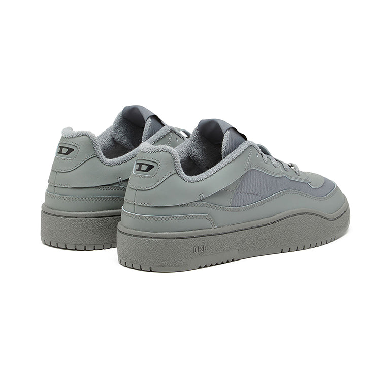 Diesel S-Oval Skate Low sneakers in a grey colorway featuring a distinctive metal D logo charm on the laces.