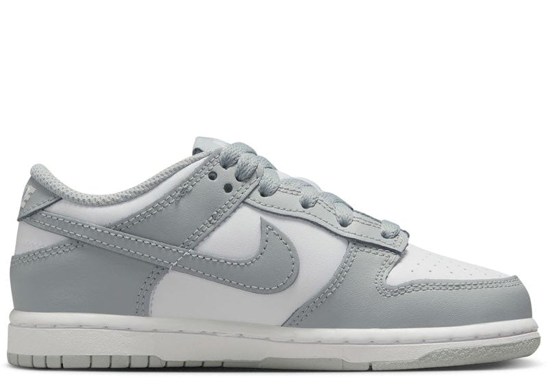 Nike Dunk Low sneakers in a white and light smoke grey colorway.