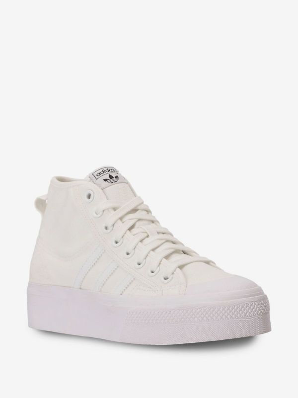 Adidas Nizza Platform Mid sneakers in "Triple White," featuring a thick flatform rubber sole.