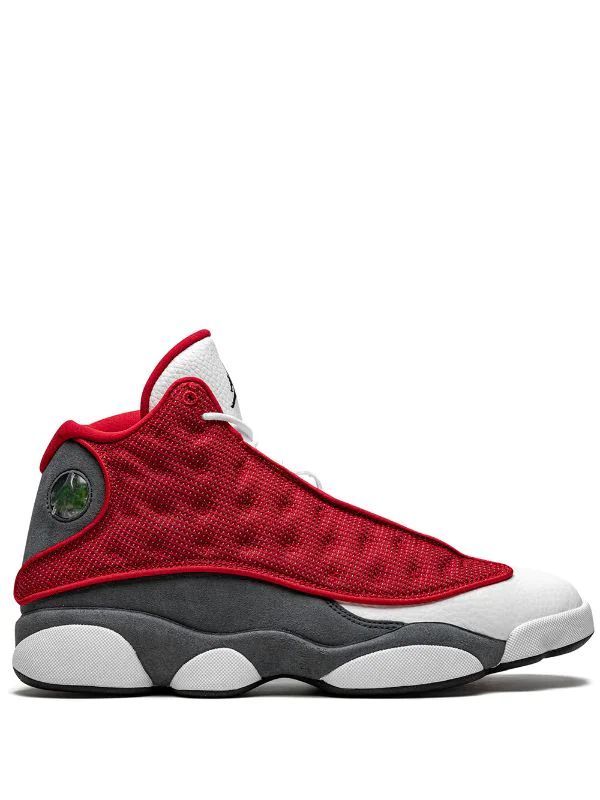 Nike Air Jordan 13 Retro sneakers in the "Gym Red Flint" colorway, featuring red reflective mesh panels.
