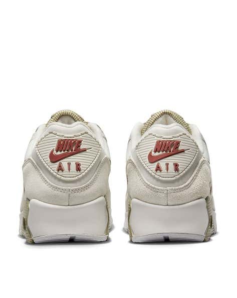 Nike Air Max 90 sneakers in the "Phantom Neutral Olive" colorway, featuring a unique textured overlay on the side.