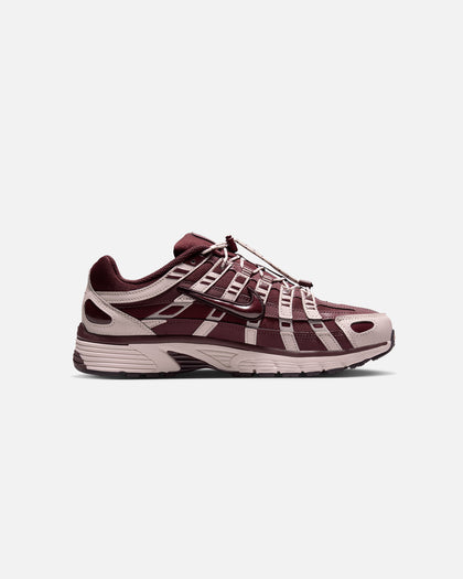 Nike Women's P-6000 sneakers in a Burgundy Crush and Taupe Grey colorway, featuring a retro-inspired design with a quick lacing system.