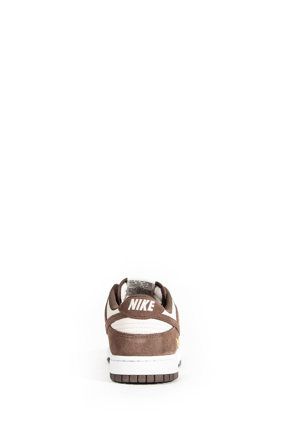 Nike Dunk Low suede-panelled sneakers in a brown and beige colorway featuring a signature swoosh logo