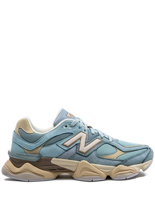 New Balance 9060 sneakers in the "Blue Haze" colorway, featuring a pastel blue and cream suede and mesh upper.
