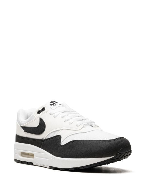 Nike Air Max 1 "Panda" sneakers in white and black with a panelled mesh upper and signature Swoosh logo.