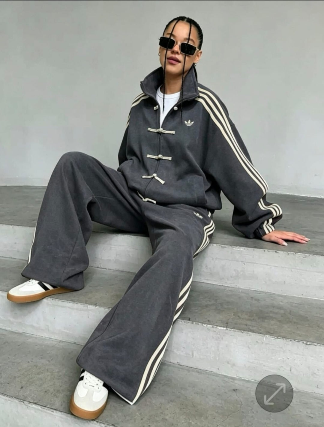 Adidas tracksuit set features unique traditional Chinese-style toggle closures.