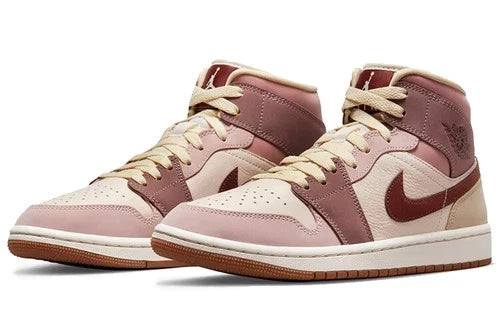 Nike Air Jordan 1 Mid SE sneakers feature a unique color scheme of "Barely Orange," "Pale Ivory," and "Smokey Mauve"