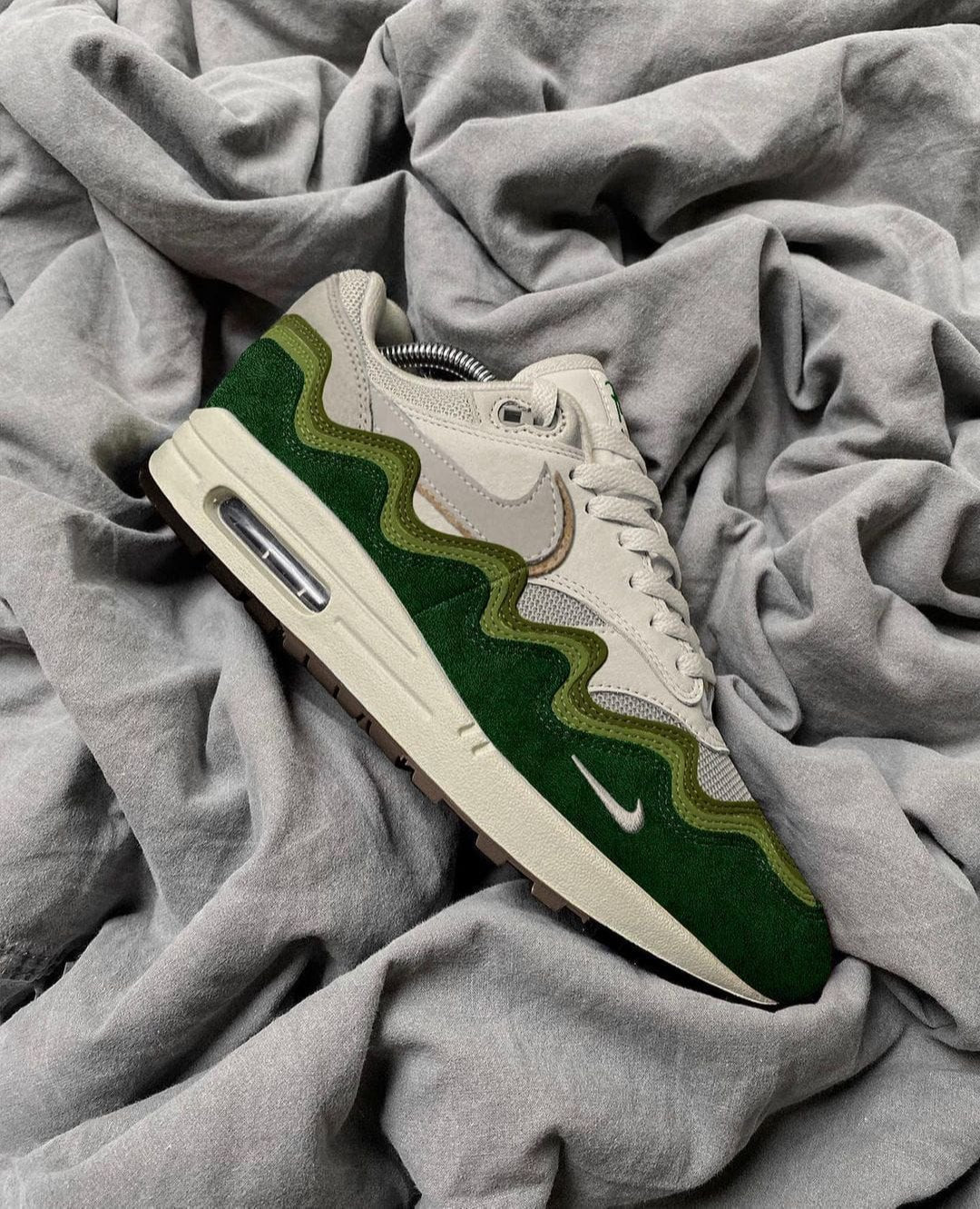 Nike Air Max 1 Patta "Chlorophyll" sneakers, featuring a distinct green wavy mudguard.