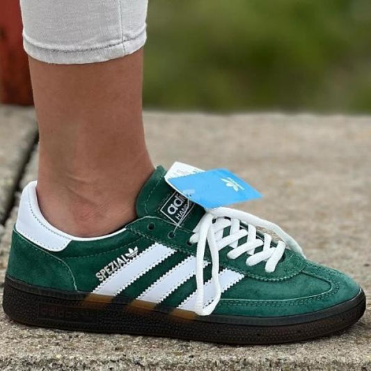 Adidas Handball Spezial sneakers in a green colorway with white stripes and a gum