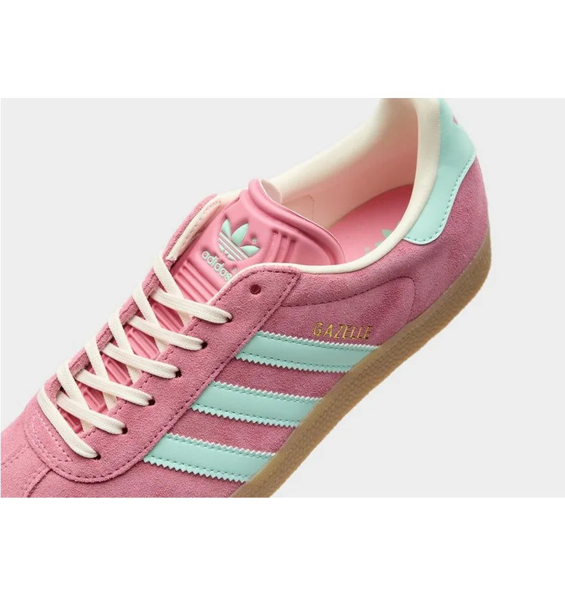 Adidas Gazelle Bold shoes featuring a vibrant pink suede upper and light green stripes.