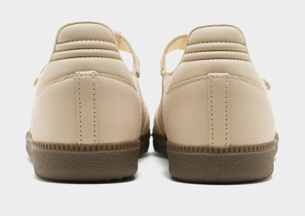adidas Originals Women's Samba Jane sneakers in a beige or cream colorway, featuring a unique Mary Jane style strap.
