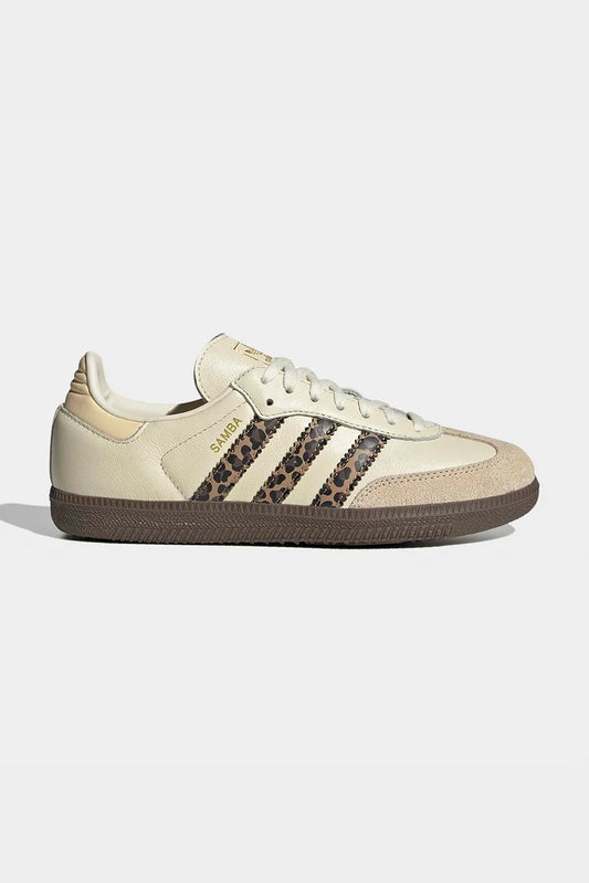 Adidas Samba OG shoes, featuring a cream-colored leather upper and a distinctive leopard print on the signature three stripes.