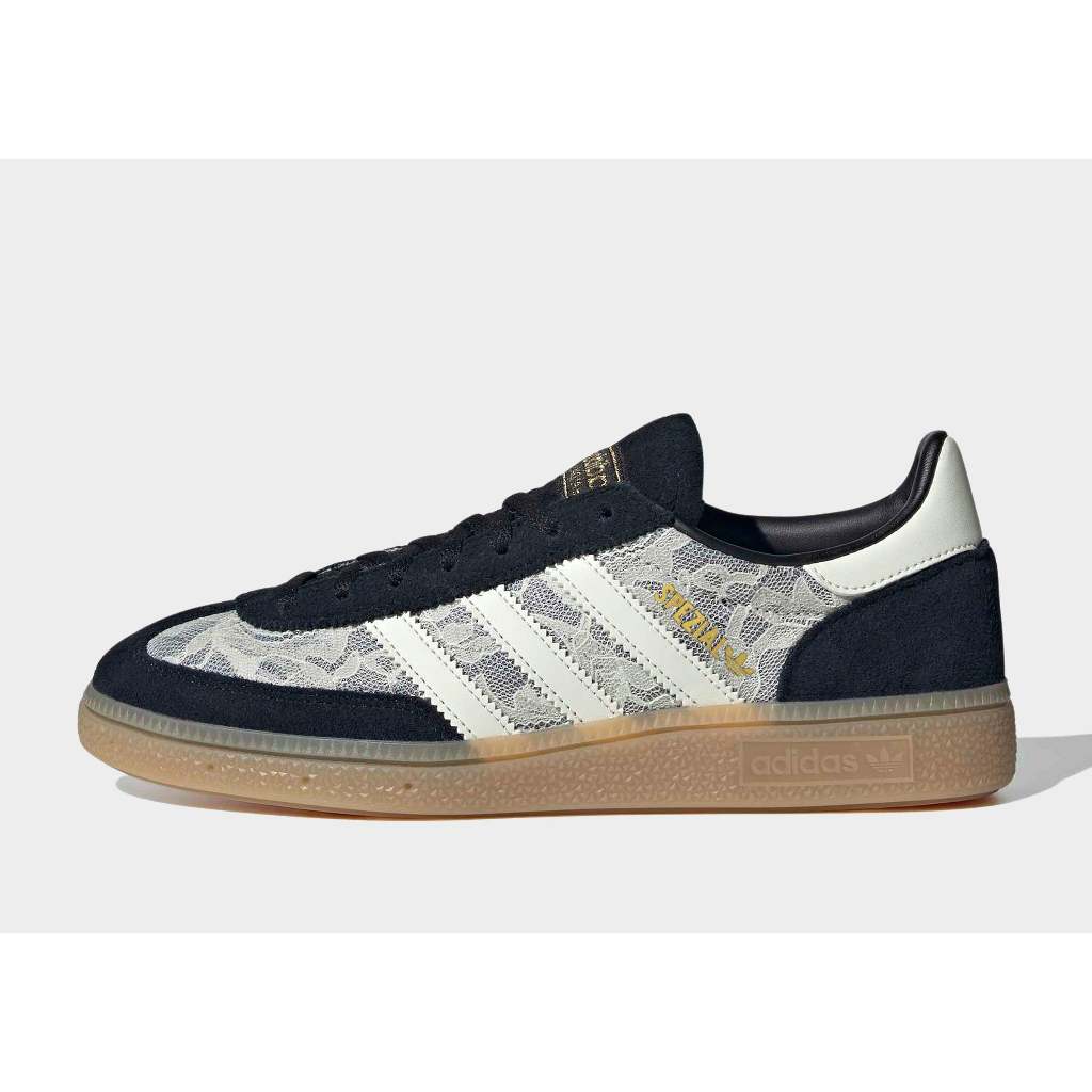 Adidas Handball Spezial sneakers in black with a white lace overlay.