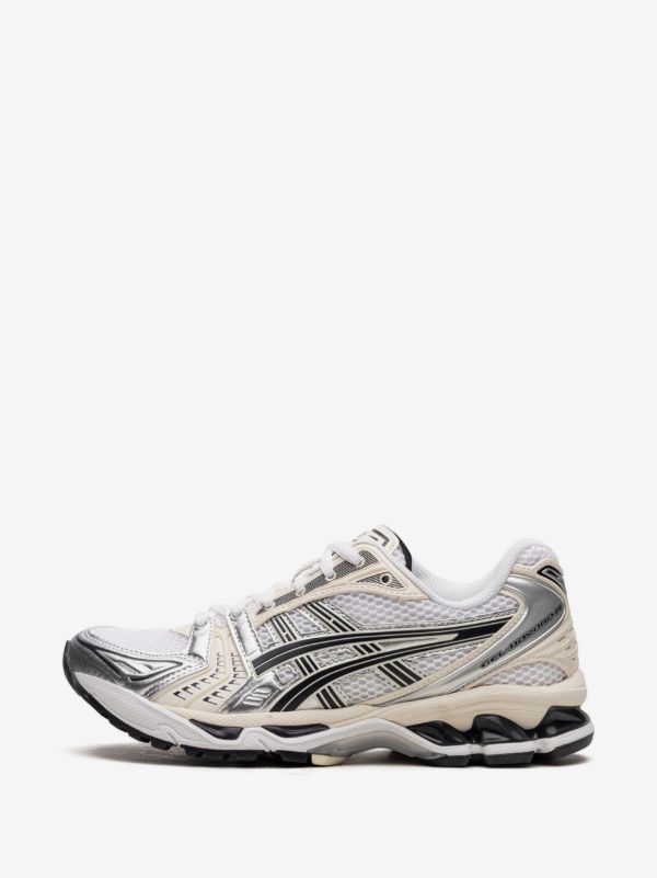 ASICS GEL-KAYANO 14 sneakers in the "White/Midnight" colorway, featuring a late 2000s running aesthetic.