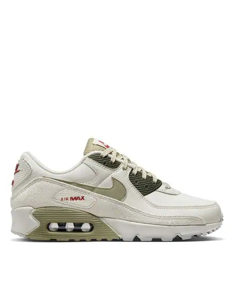 Nike Air Max 90 sneakers in the "Phantom Neutral Olive" colorway, featuring a unique textured overlay on the side.