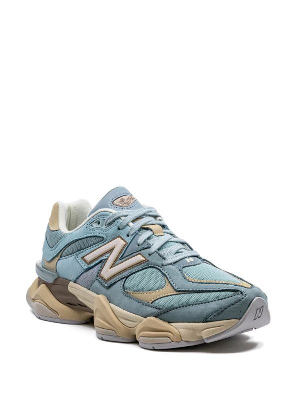 New Balance 9060 sneakers in the "Blue Haze" colorway, featuring a pastel blue and cream suede and mesh upper.
