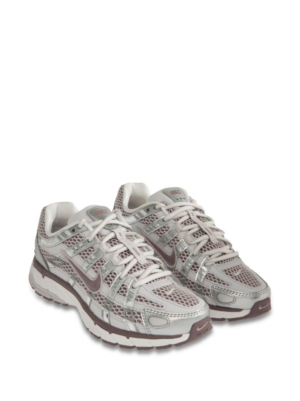 Nike P-6000 sneakers in a silver and purple colorway, featuring a breathable mesh upper with contrasting paneling.