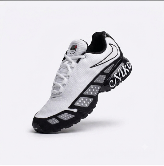 Nike Air Max Sunder sneakers featuring a white upper with black accents and a cursive "Nike" logo on the side
