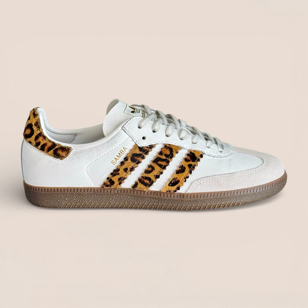 Adidas Samba OG sneakers featuring a distinct leopard print on the three stripes and heel patch.