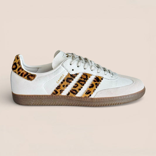 Adidas Samba OG sneakers featuring a distinct leopard print on the three stripes and heel patch.