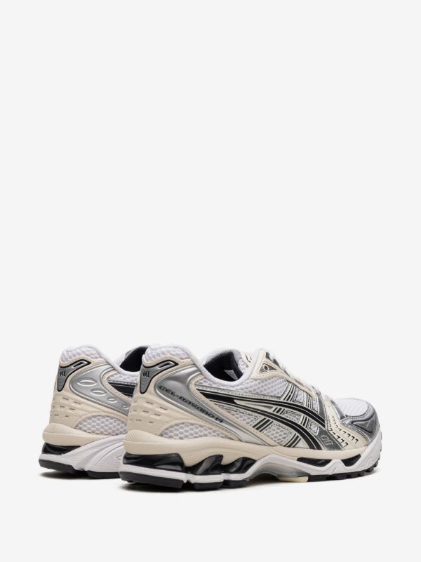 ASICS GEL-KAYANO 14 sneakers in the "White/Midnight" colorway, featuring a late 2000s running aesthetic.