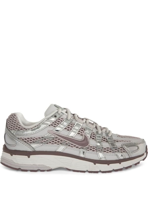 Nike P-6000 sneakers in a silver and purple colorway, featuring a breathable mesh upper with contrasting paneling.